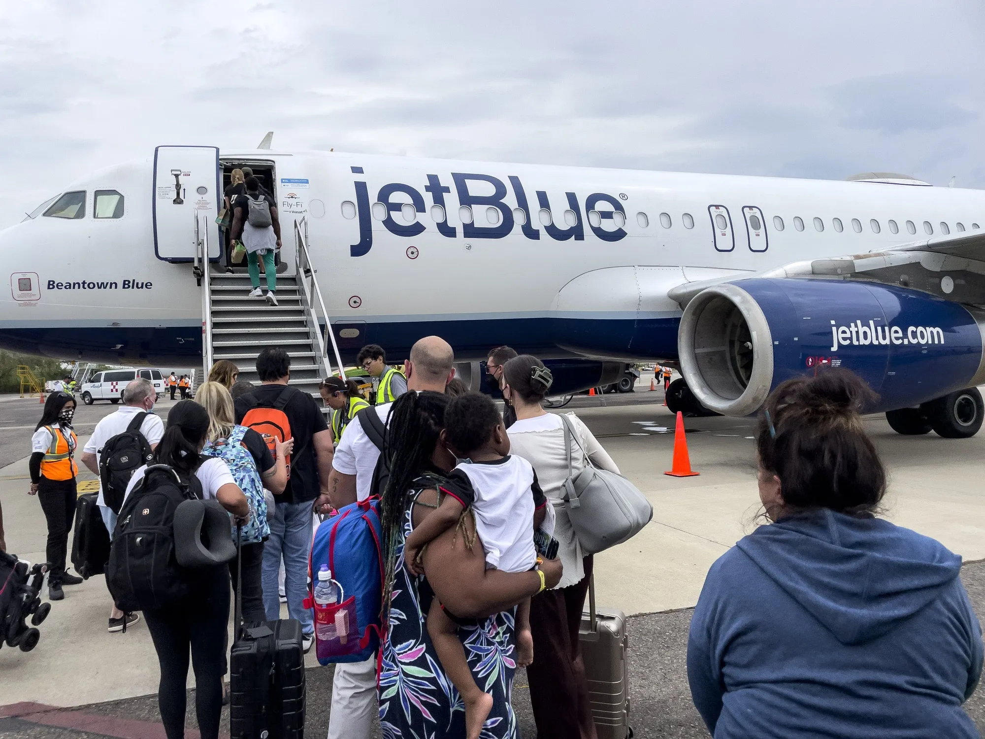 Passengers board a JetBlue airplane at Licenciado Gustavo Diaz Ordaz International Airport in Puerto Vallarta, Mexico.