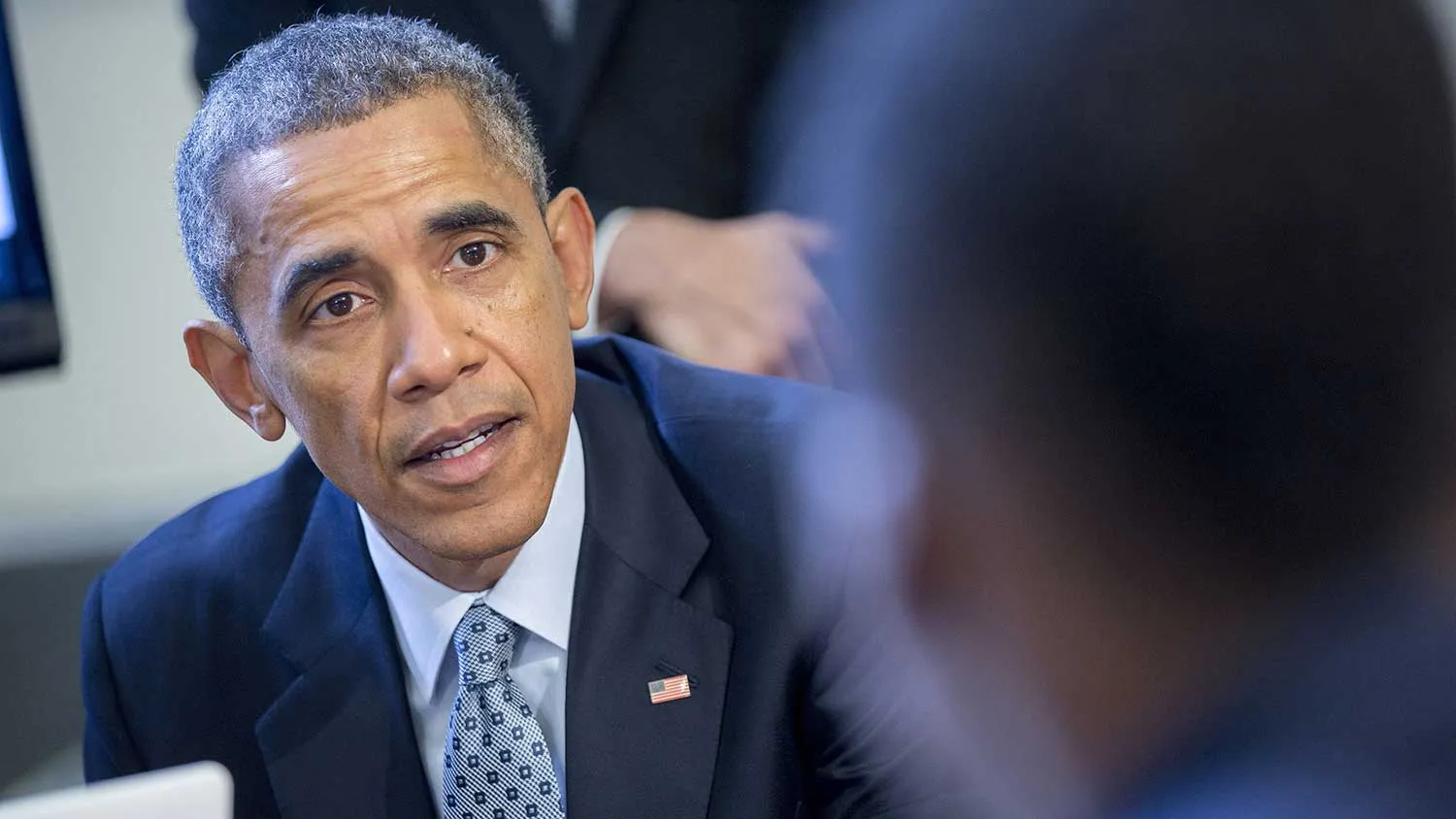 U.S. President Barack Obama talks to middle-school students who are participating in an "Hour of Code" event in the Eisenhower Executive Office Building next to the White House in Washington, D.C., U.S., on Monday, Dec. 8, 2014.
