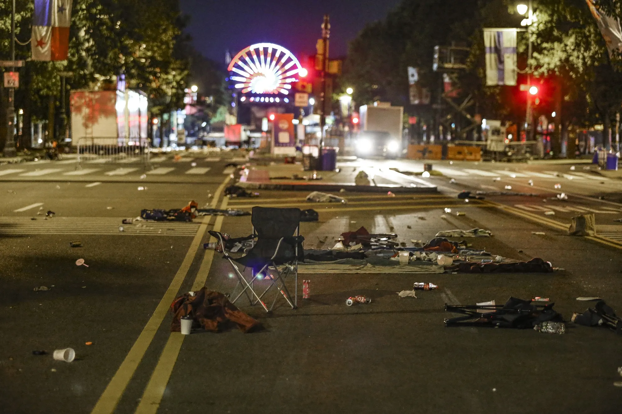 Debris left in the street as people fled as gunshots rang out on the Parkway during the July 4th fireworks show in Philadelphia on Monday, July 4, 2022.  Two Philadelphia police officers working at the city’s Fourth of July celebration suffered graze wounds when shots rang out, causing scores of frightened people to flee the scene on foot.  (Steven M. Falk/The Philadelphia Inquirer via AP)