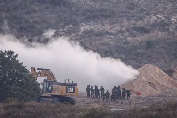 Israeli soldiers spray gas at&nbsp;a tunnel used by Hamas militants to infiltrate Israeli lines.