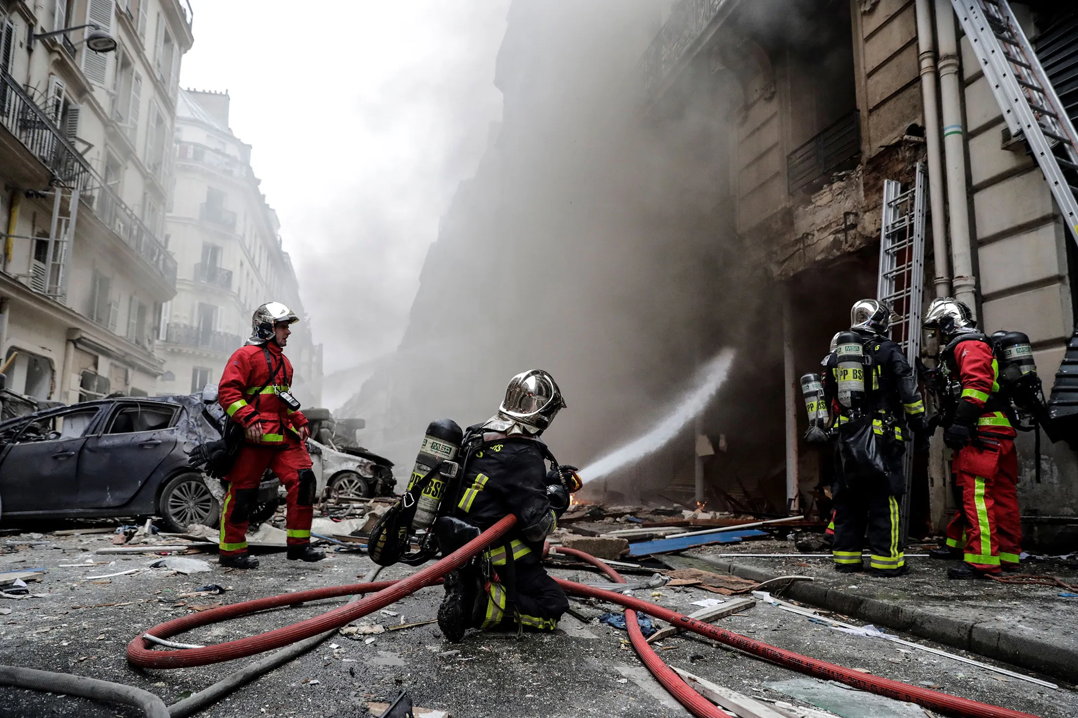 Firefighters extinguish a fire on Rue de Trevise in central Paris on Jan.&nbsp;12.&nbsp;