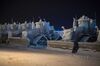 A row of bulldozers used at North Slope oil fields, covered in a thick layer of frost, parked at Deadhorse, Alaska, in December 2016.