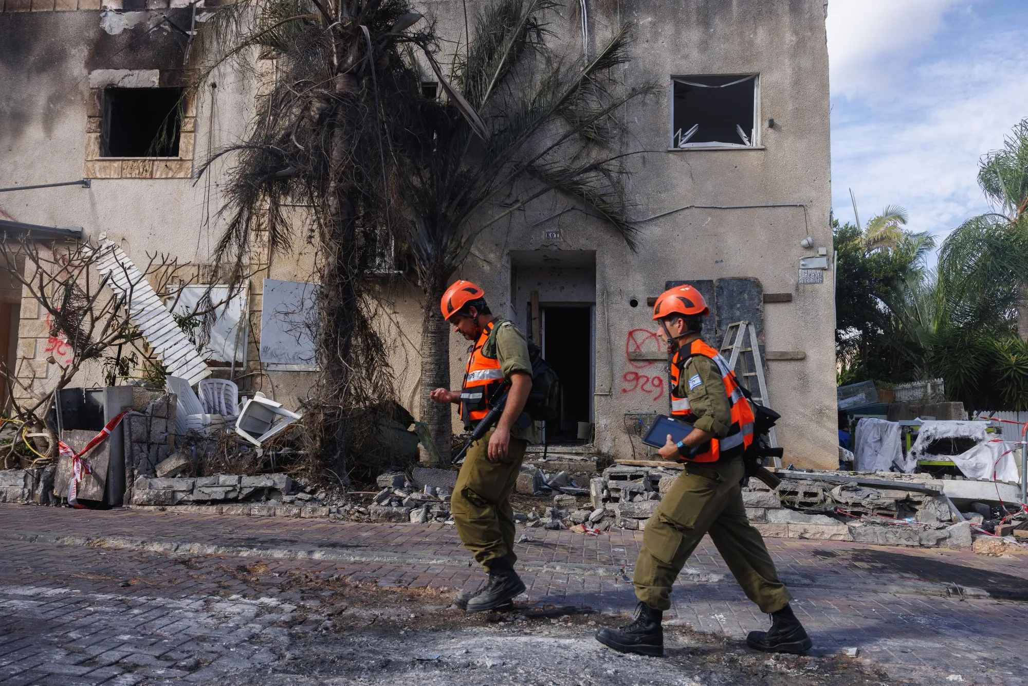 Members of the home front command at the scene of a missile strike by Hezbollah in Kiryat Bilaik, northern Israel, on Sept. 22, 2024.