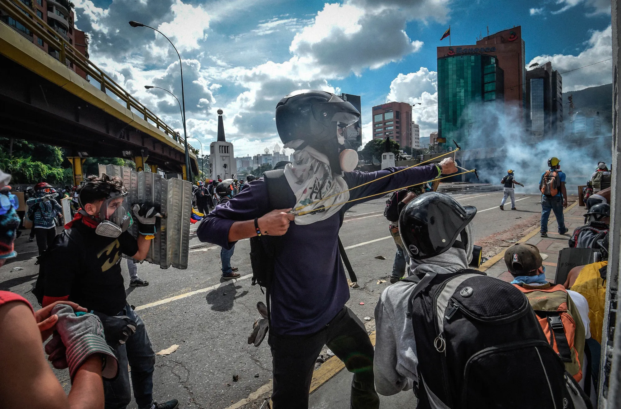 Activists clash with police as they block the Autopista Francisco Fajardo highway in Caracas in 2017. Deadly battles filled the streets, but the Maduro regime has persisted.&nbsp;