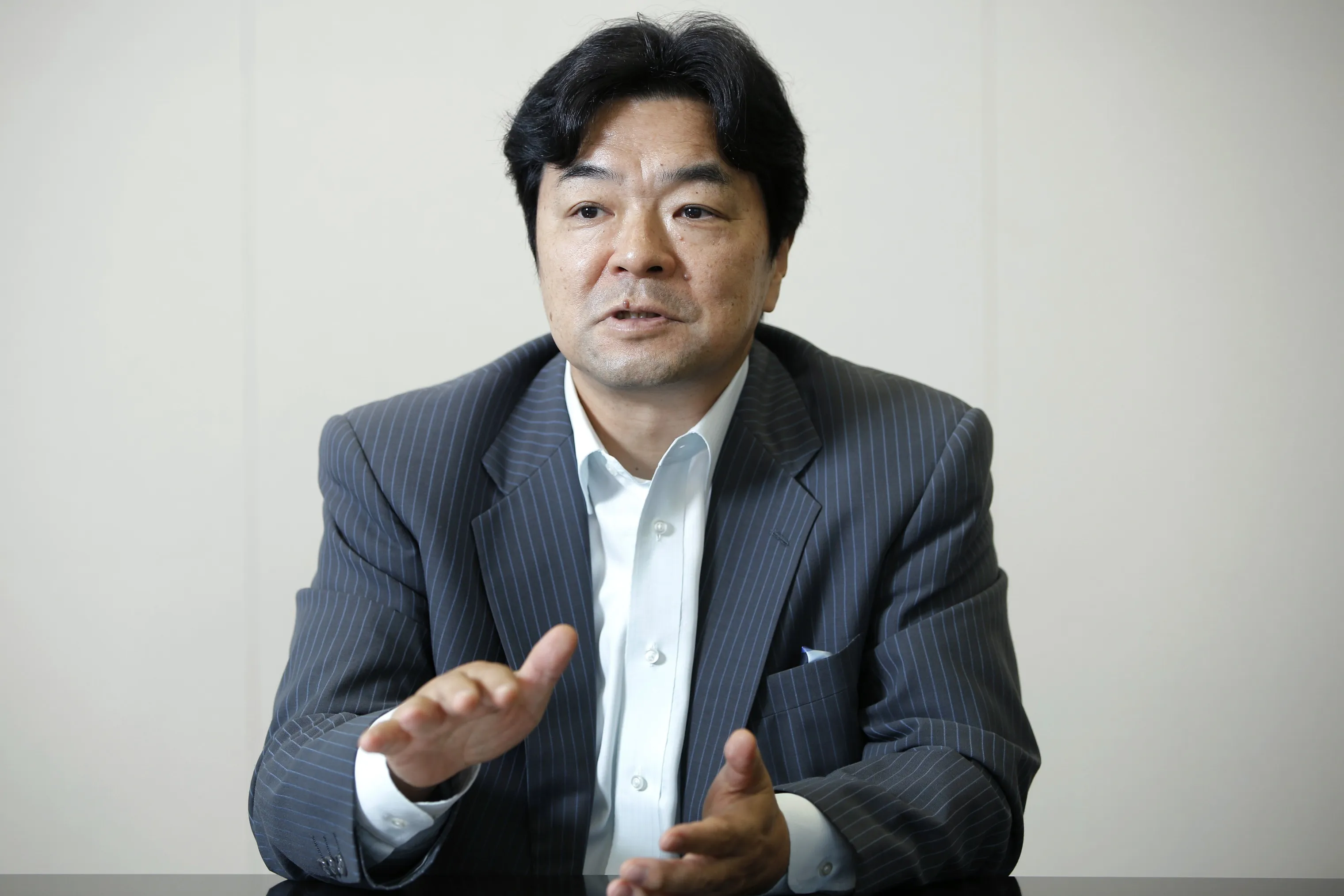 Susumu Takahashi, chairman of the Japan Research Institute, speaks during an interview at the institute's head office in Tokyo, Japan, on Monday, Sept. 1, 2014. It is vital to confirm that Japan's economic recovery has momentum before the sales tax is raised further, said Takahashi, a private-sector member of the Council on Economic and Fiscal Policy.