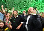 Everything's coming up Green: Party leaders Robert Habeck, left, and Anton Hofreiter, right, celebrate the Green victory in Munich on Sunday.
