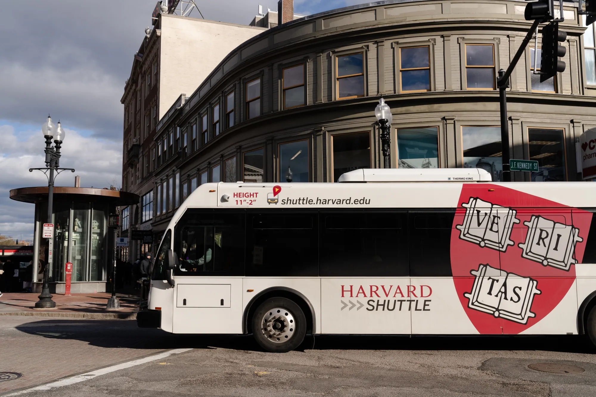 A Harvard University bus crosses Harvard Square in Cambridge, Massachusetts.