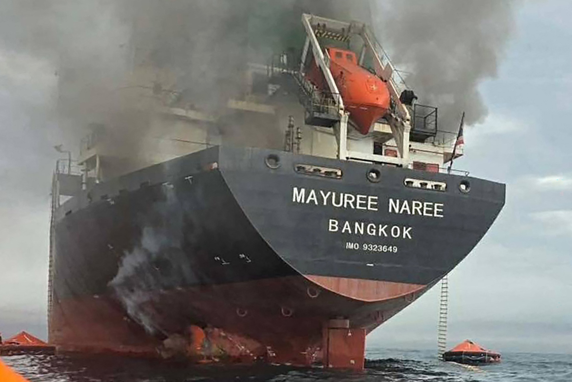 TOPSHOT - This handout photo taken on March 11, 2026 and released by the Royal Thai Navy shows smoke rising from the Thai bulk carrier 'Mayuree Naree' near the Strait of Hormuz after an attack. A Thai bulk carrier travelling in the crucial Strait of Hormuz was attacked March 11, with 20 crew members rescued so far, the Thai navy said. (Photo by Handout / ROYAL THAI NAVY / AFP via Getty Images) / -----EDITORS NOTE --- RESTRICTED TO EDITORIAL USE - MANDATORY CREDIT "AFP PHOTO / ROYAL THAI NAVY " - NO MARKETING - NO ADVERTISING CAMPAIGNS - DISTRIBUTED AS A SERVICE TO CLIENTS -