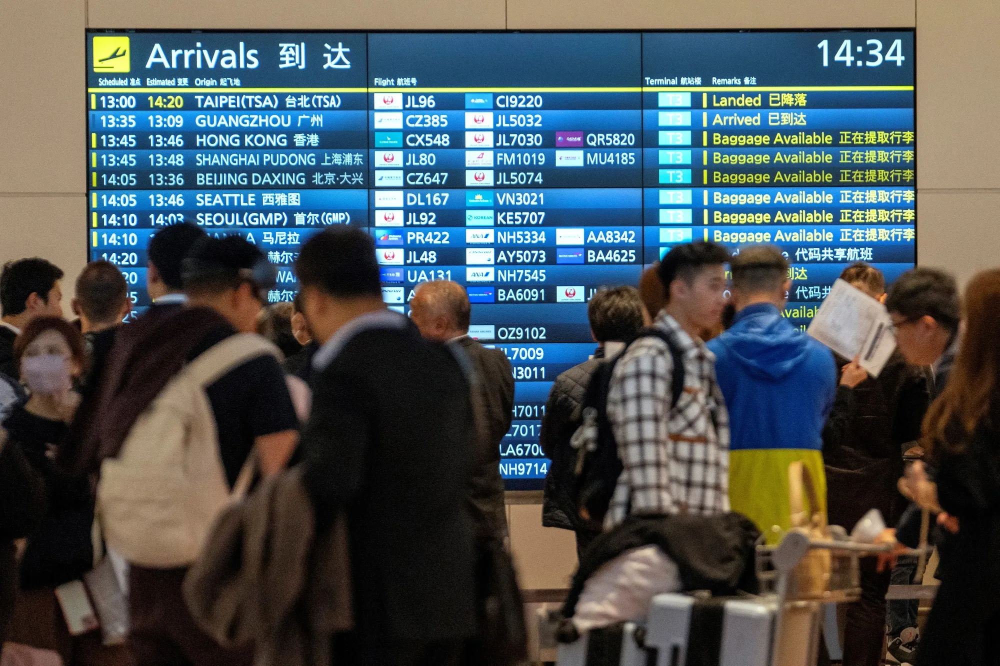 A flight information panel in the international arrivals hall at Haneda Airport in Tokyo on Nov. 19.
