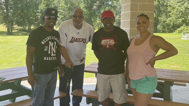 Community organizers Ethan West, Sherman Jones, and Aric Bowens pictured with Dr. Tara L. Conley during the filming of DRY BONES in Elyria, Ohio.