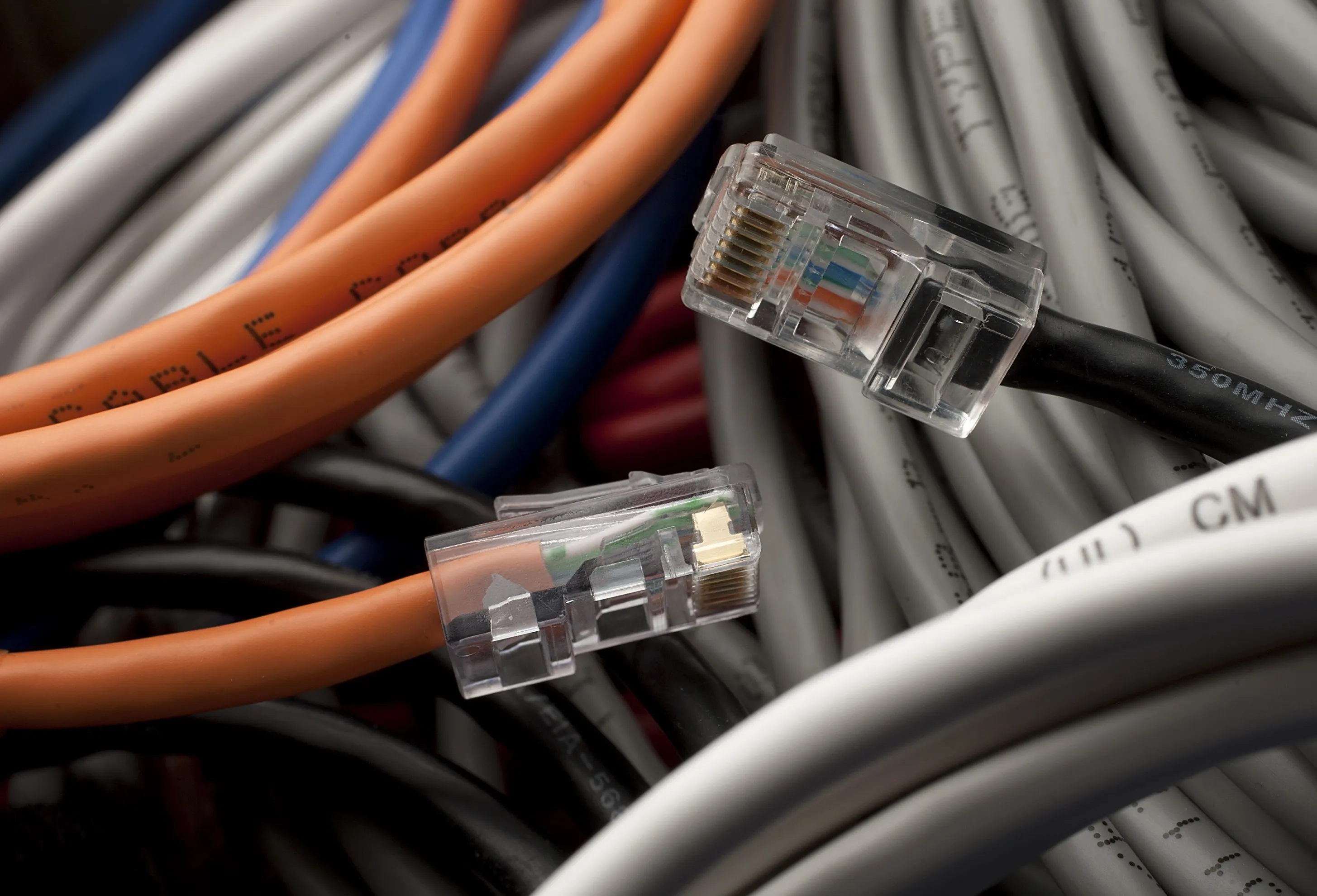 Ethernet cords are arranged for a photograph in New York, U.S., on Friday, Feb. 10, 2012. Ethernet is a family of computer networking technologies for local area networks (LAN) commercially introduced in 1980.