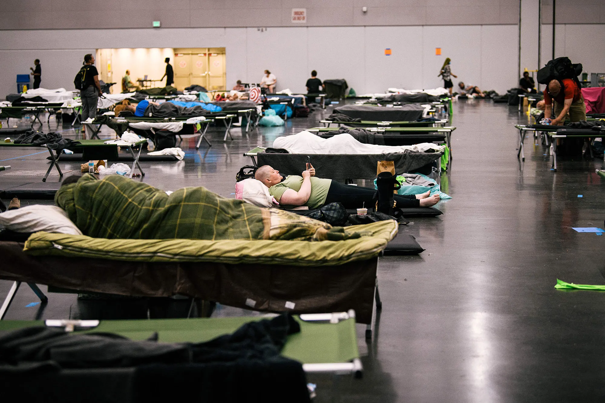 People rest at the Oregon Convention Center cooling station in&nbsp;Portland on June 28.