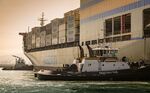 Tugboats guide the Matson Inc. Mokihana cargo ship into the Port of Long Beach in Long Beach, California, U.S., on&nbsp;April 4, 2018.