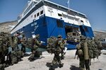 Greek soldiers prepare to board a ferry at the port of the tiny Greek island of Kastellorizo, on Aug. 28.