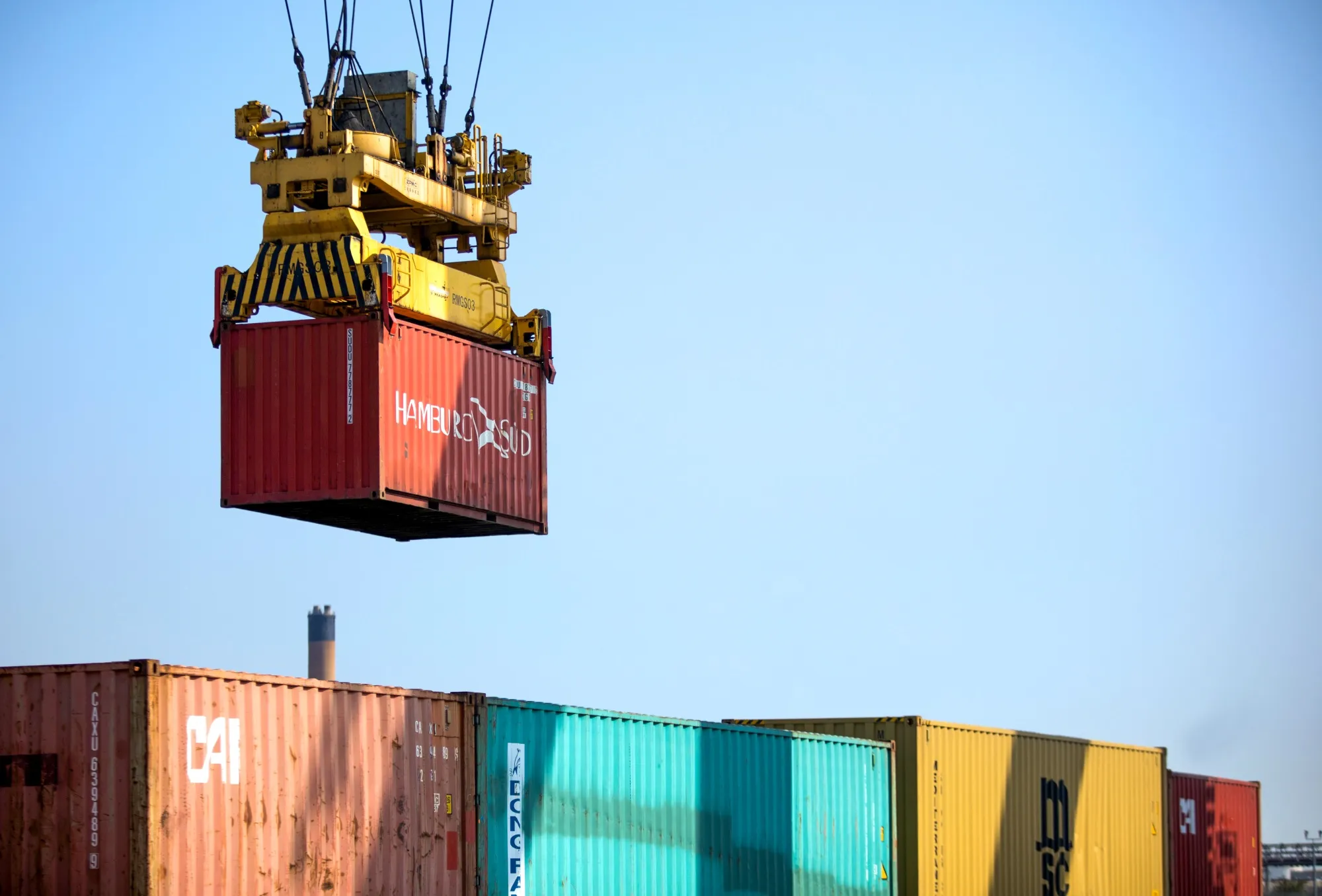 A crane moves a container at London Gateway port.