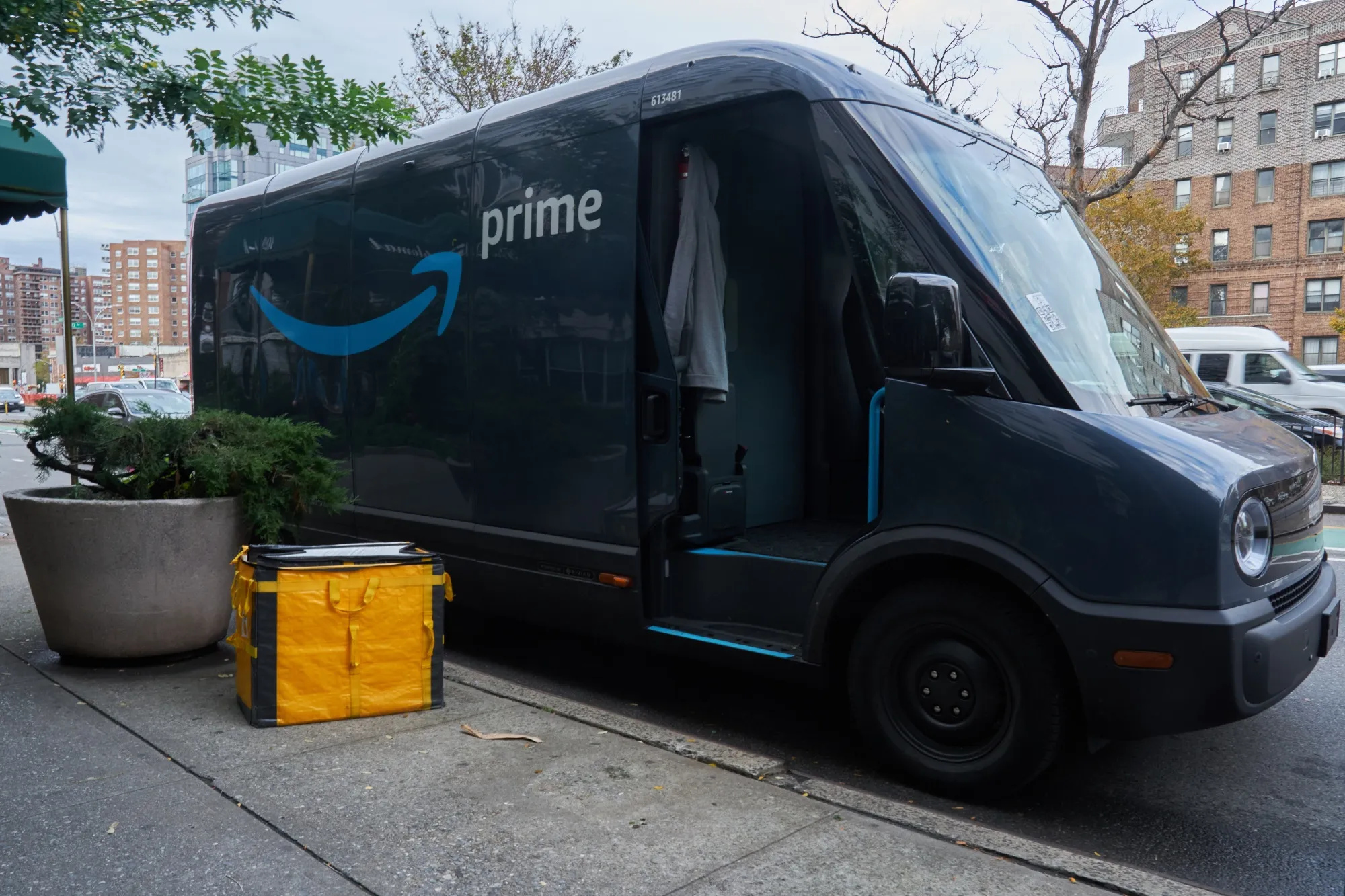 An Amazon electric delivery van manufactured by Rivian&nbsp;out for deliveries in the Queens borough of New York City.