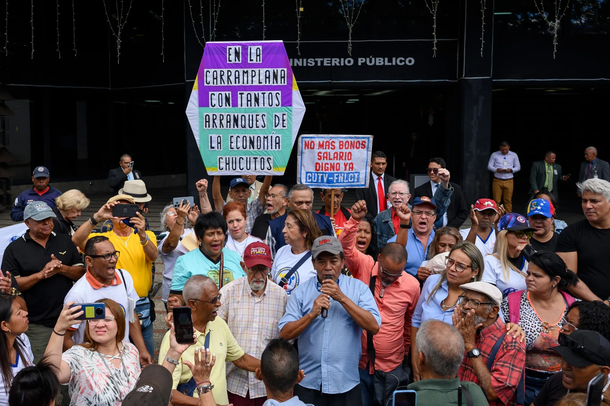Demonstrators during a protest in support of public sector workers outside the Public Ministry of Venezuela headquarters in Caracas, on&nbsp;Jan. 9, 2024.&nbsp;