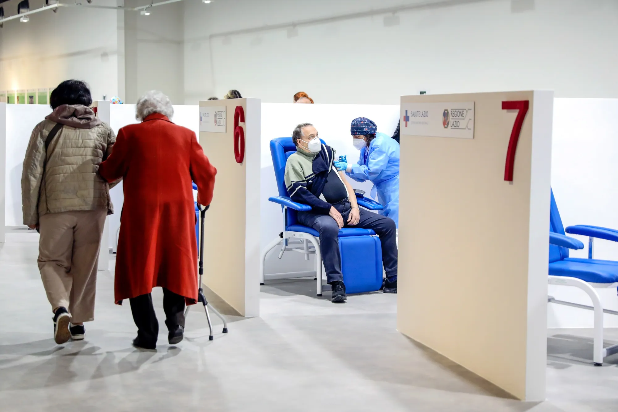 A health worker administers the Moderna Inc. Covid-19 vaccine to a visitor at a Covid-19 vaccination center in Rome, Italy, on&nbsp;March 17.