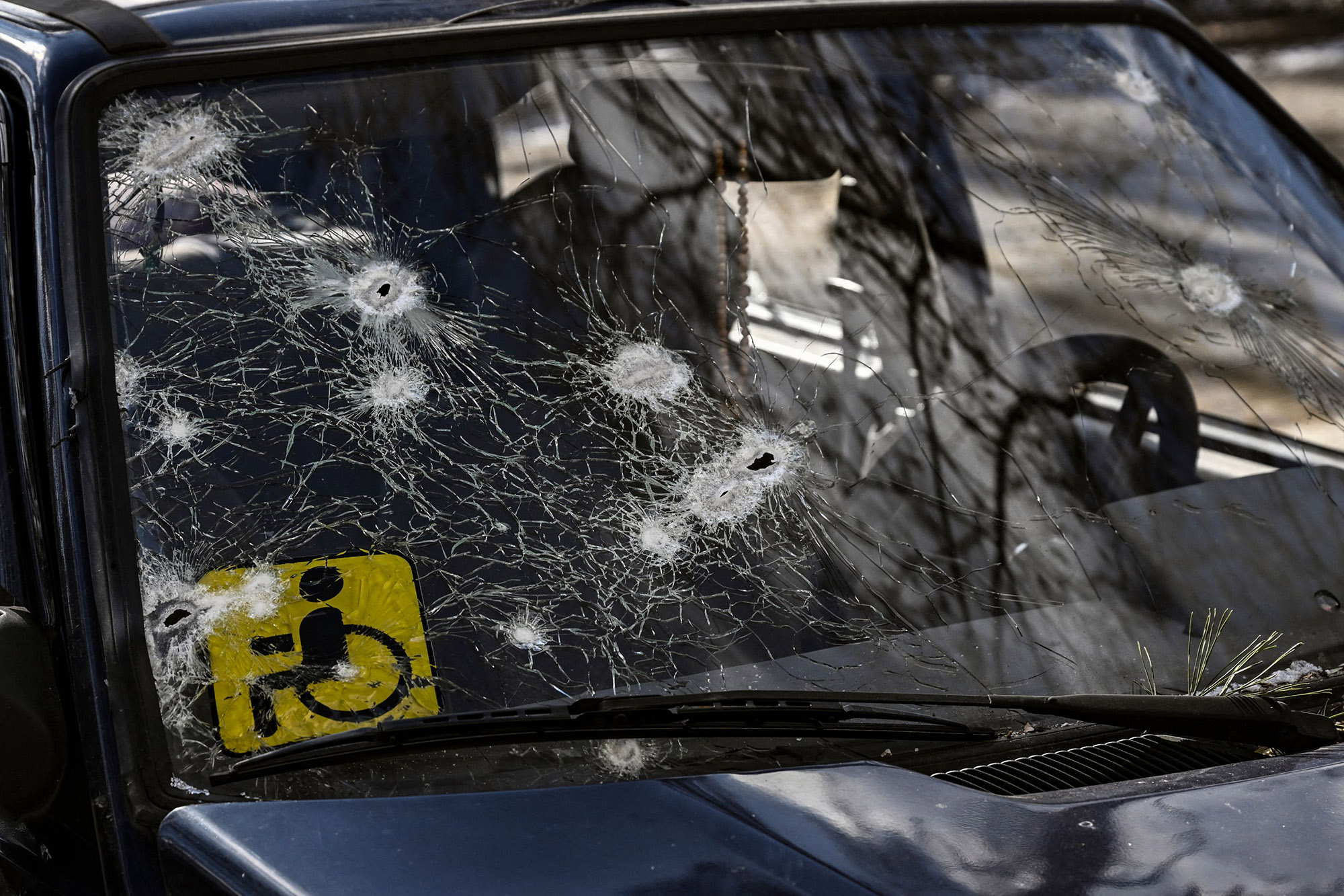 A car riddled with bullets in Irpin, north of Kyiv, on March 10. Ukrainians have been trying to evacuate the city as the Kremlin attack continues. Some have reportedly claimed that Russian soldiers are targeting civilians.