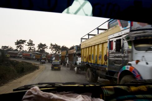 Trucks Carrying Coal Sit In Traffic