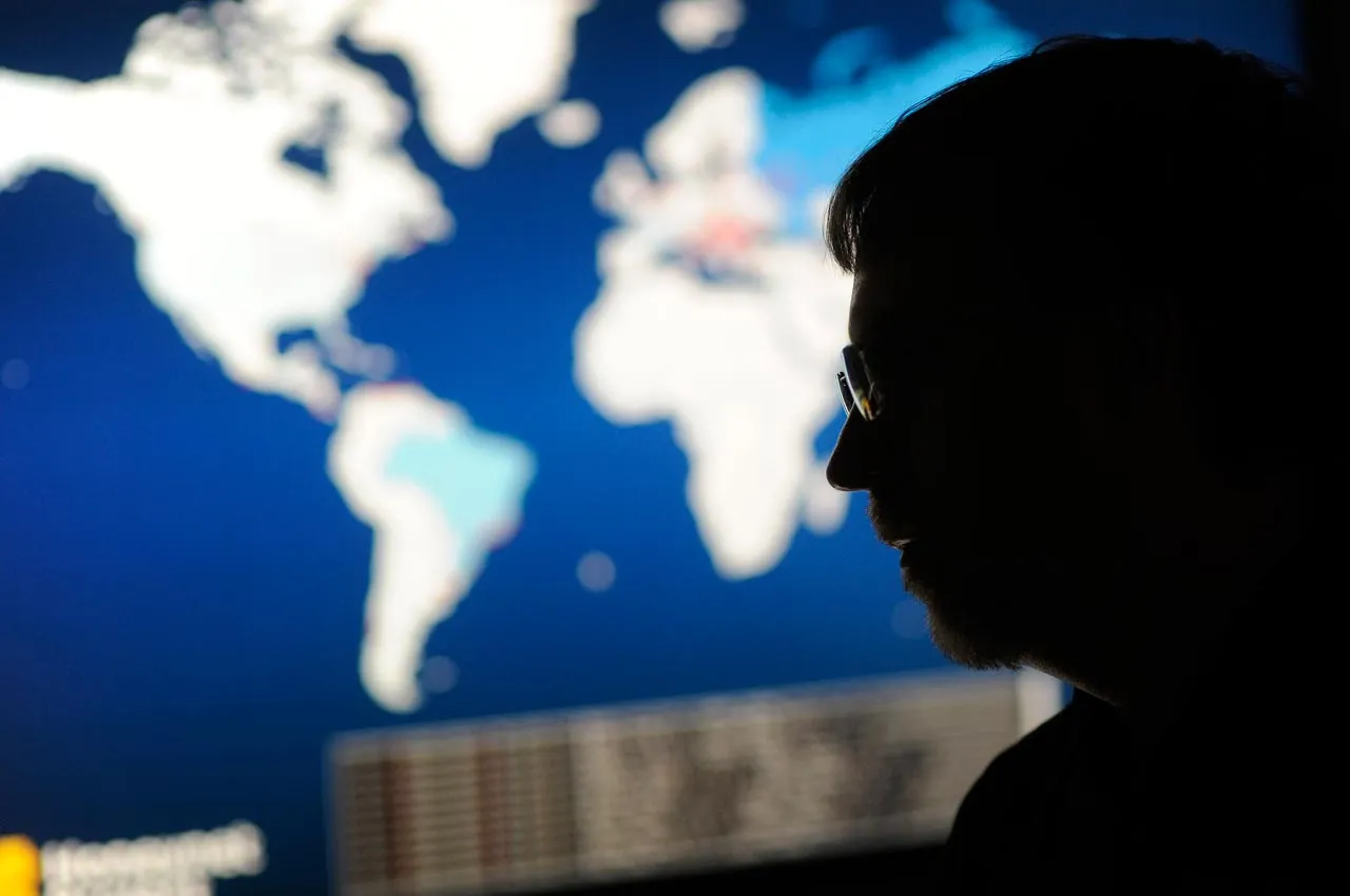The director of malware research at Dell SecureWorks in front of large wall mounted monitors in his office in Myrtle Beach, South Carolina. Photographer: Stephen Morton/Bloomberg