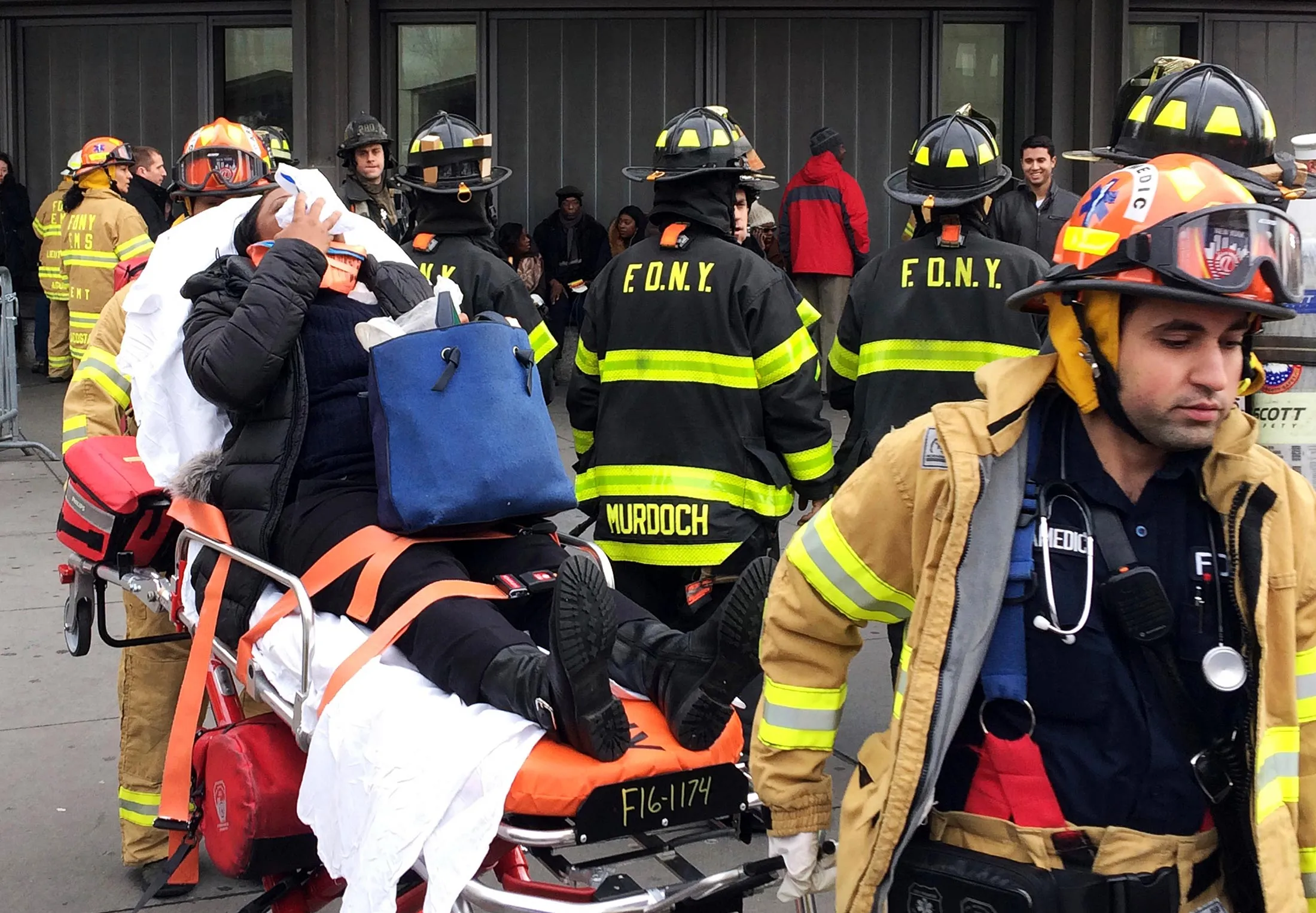 An injured passenger is taken from the Atlantic Terminal, in the Brooklyn borough of New York, Wednesday, Jan. 4, 2017.
