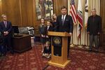 San Francisco Interim Mayor Mark Farrell, joined by family members, speaks to reporters after being sworn into office at City Hall in San Francisco