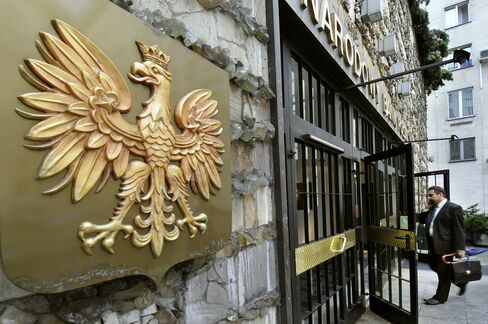 The White Eagle, the national emblem of Poland, hangs at the entrance to the central bank of Poland in Warsaw, Poland.