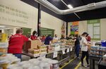 Volunteers fill boxes at a food bank distribution warehouse in Omaha, Nebraska, U.S.