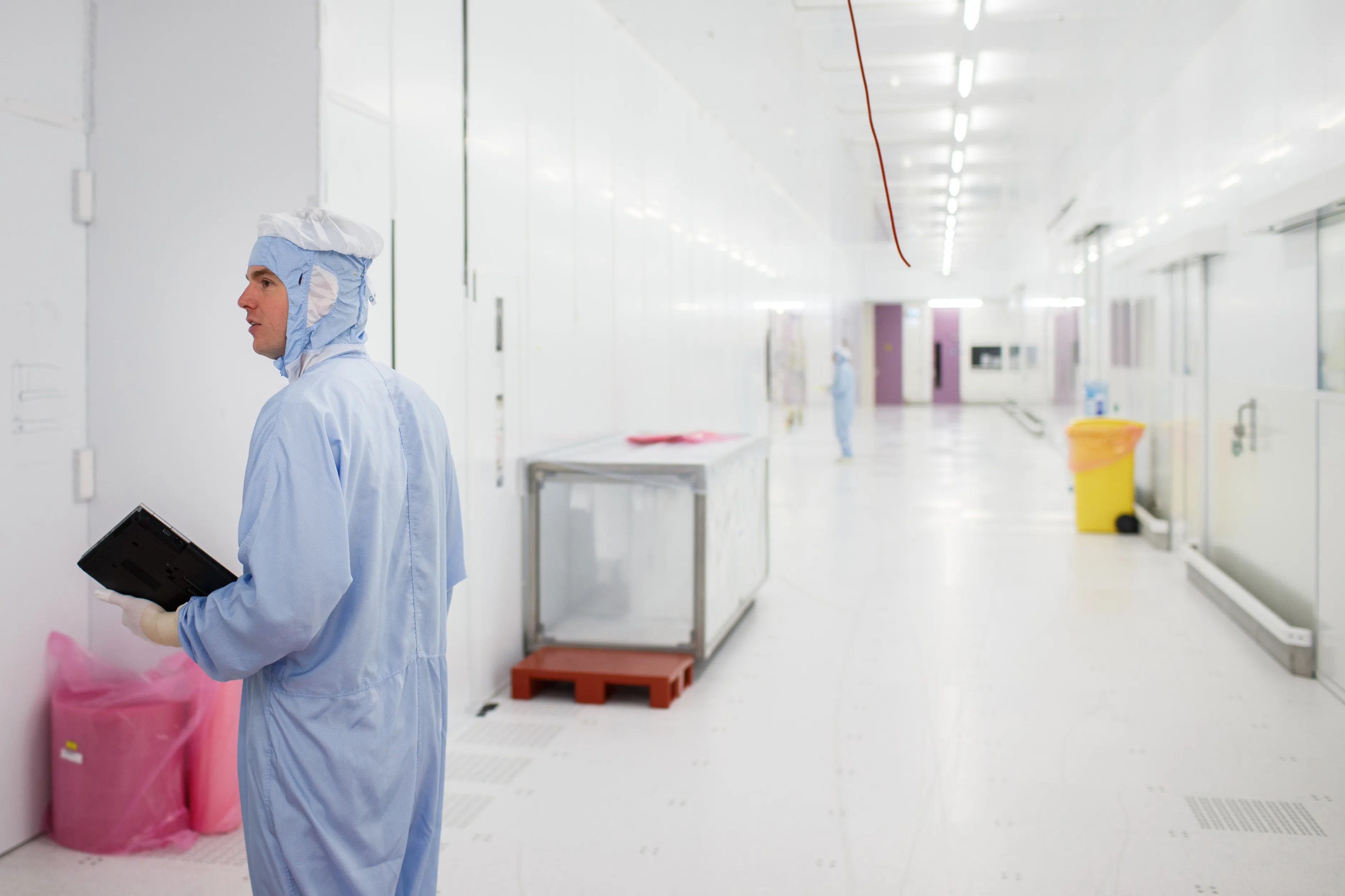 An employee wears protective clothing at the ASML factory in Veldhoven, Netherlands.