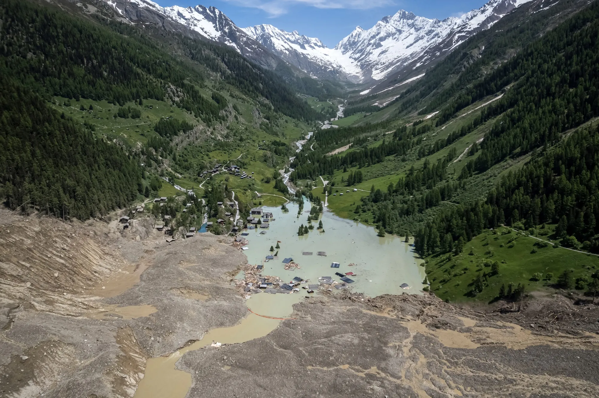 Debris in the village of Blatten, submerged by the river Lonza, following the Birch glacier collapse&nbsp;in Switzerland, on May 31.
