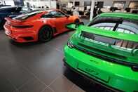 Porsche sports cars at a showroom in Berlin.