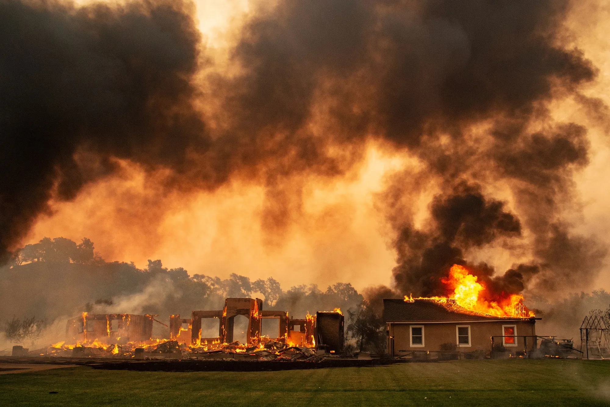 &nbsp;A building is engulfed in flames at a vineyard during the Kincade fire near Geyserville, California on Oct. 24.