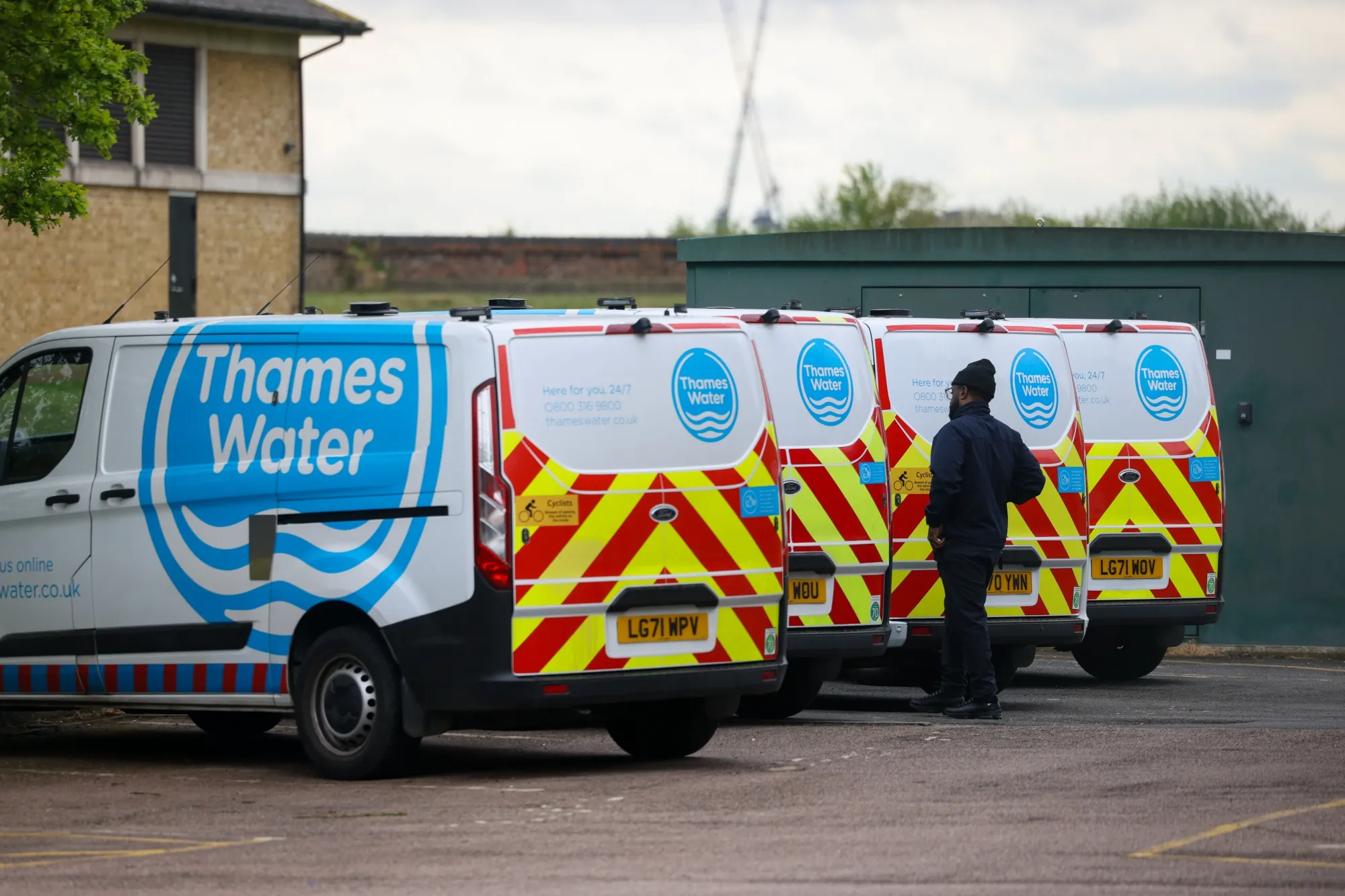 Engineers' vans parked at the Thames Water South Woodford pumping station&nbsp;in London.