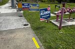 Campaign signs at a polling location in Miami on Aug. 23. In many local elections, races for positions like school board member have become magnets for online vitriol and offline harassment. 
