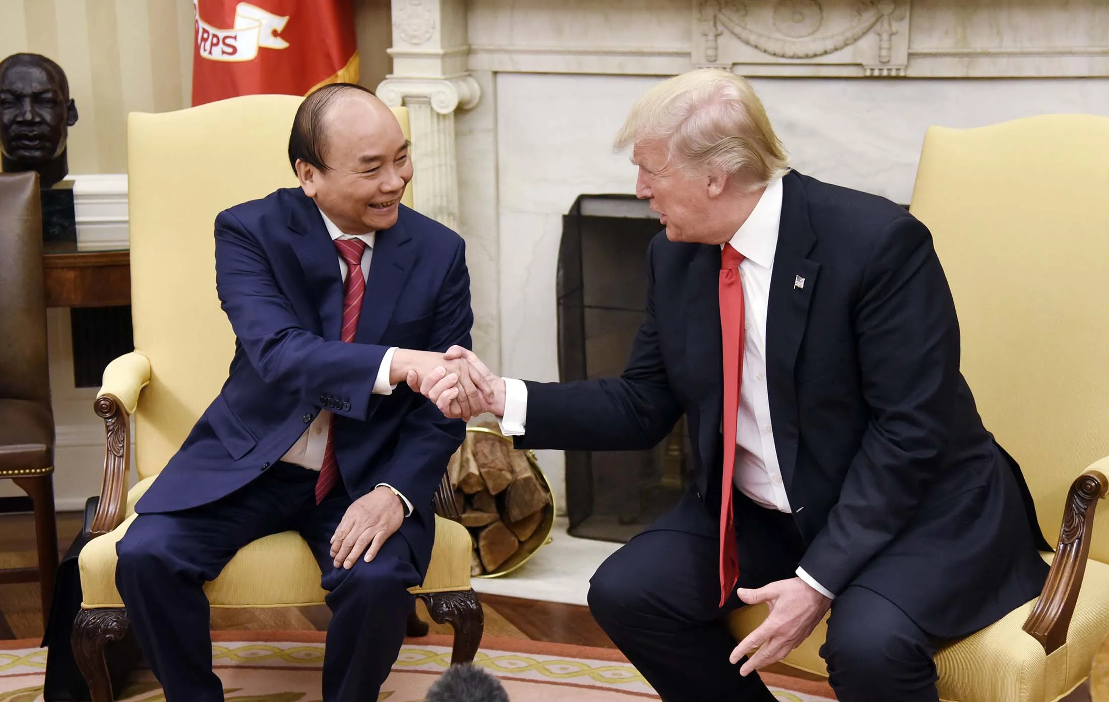 U.S. President Donald Trump, right, shakes hands with Nguyen Xuan Phuc, Vietnam's prime minister, at the White House.
