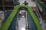 An employee works on the production line of the Swire Coca-Cola Beverages Hubei in Wuhan on March 24.