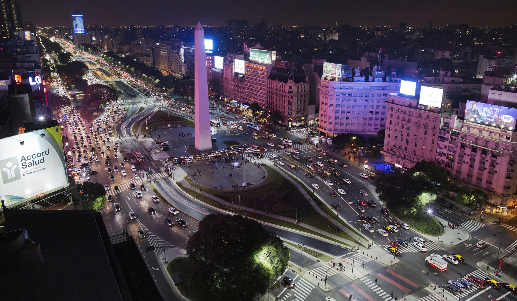 Cars drive down Avenida 9 de Julio in Buenos Aires, Argentina.
