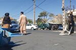 Taliban fighters block a road after a blast in the Guzargah Mosque in Herat, Afghanistan, on Sept. 2.