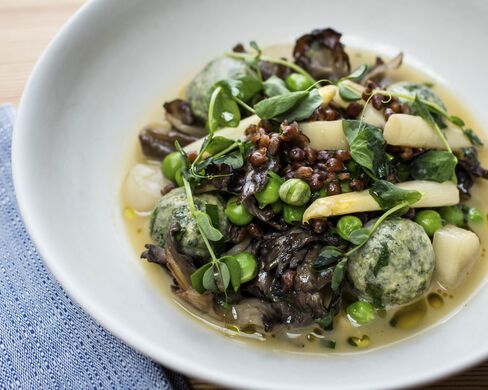 The food is vegetarian (and in many cases vegan, as well) but it appeals to a wide range of eaters with big, bold flavors, as in this dish of smoky mushrooms with tender green dumplings.