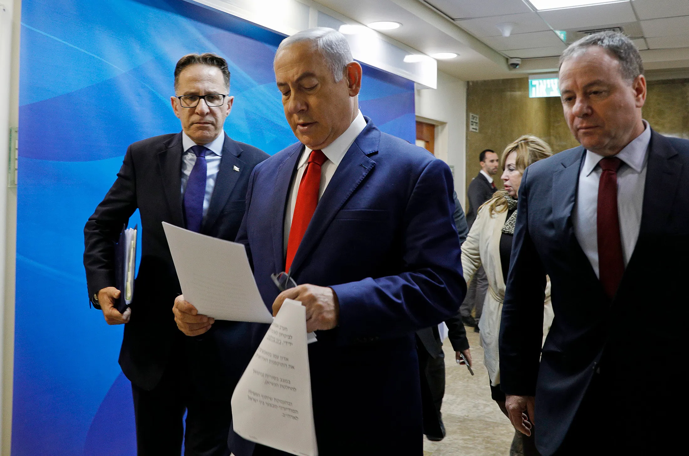 Israeli Prime Minister Benjamin Netanyahu reads a document as he arrives to the weekly cabinet meeting at his Jerusalem office on Jan.&nbsp;6.
