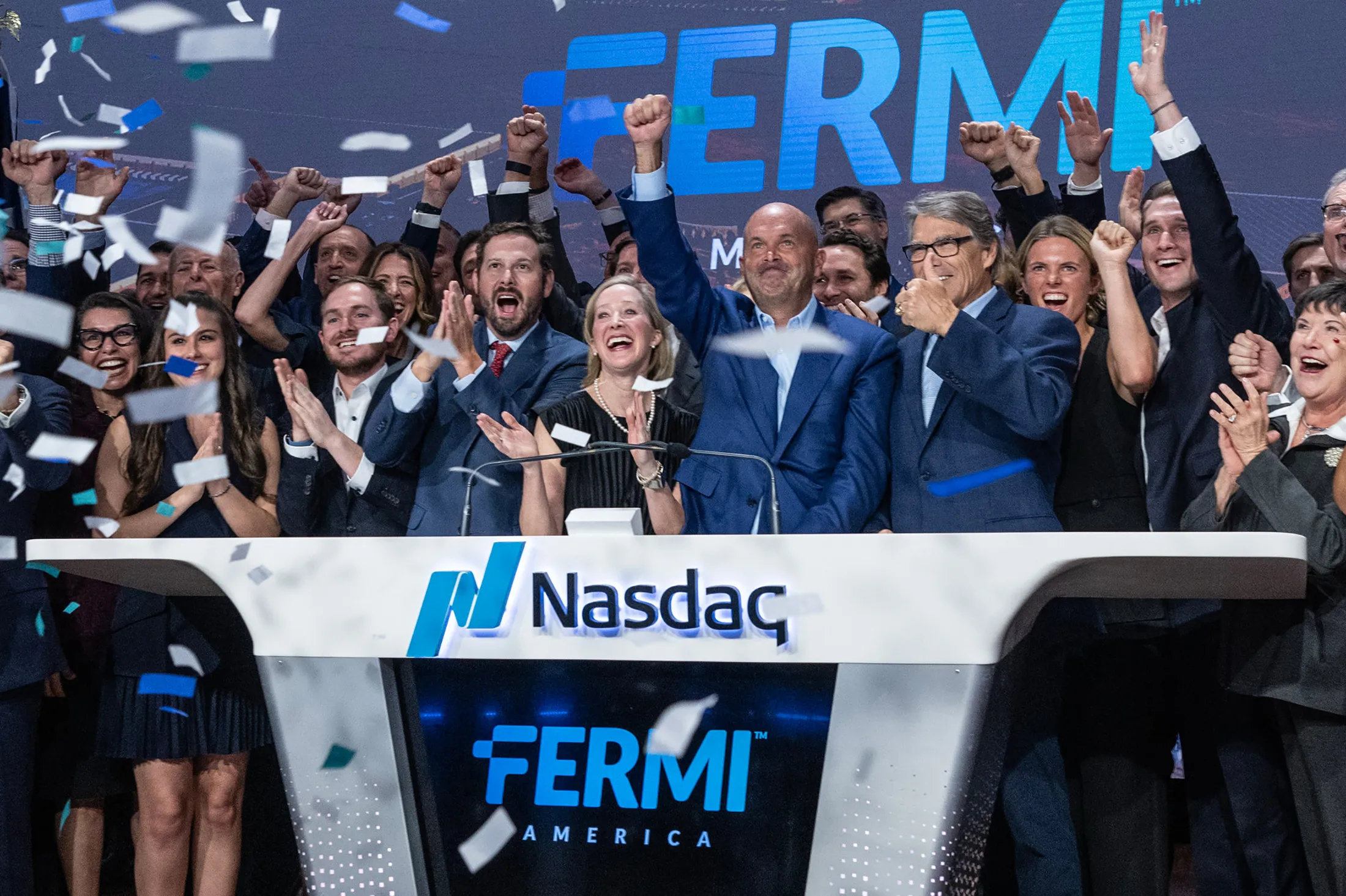 Toby Neugebauer (center right) and Rick Perry (to his right) in happier times after Fermi’s IPO.