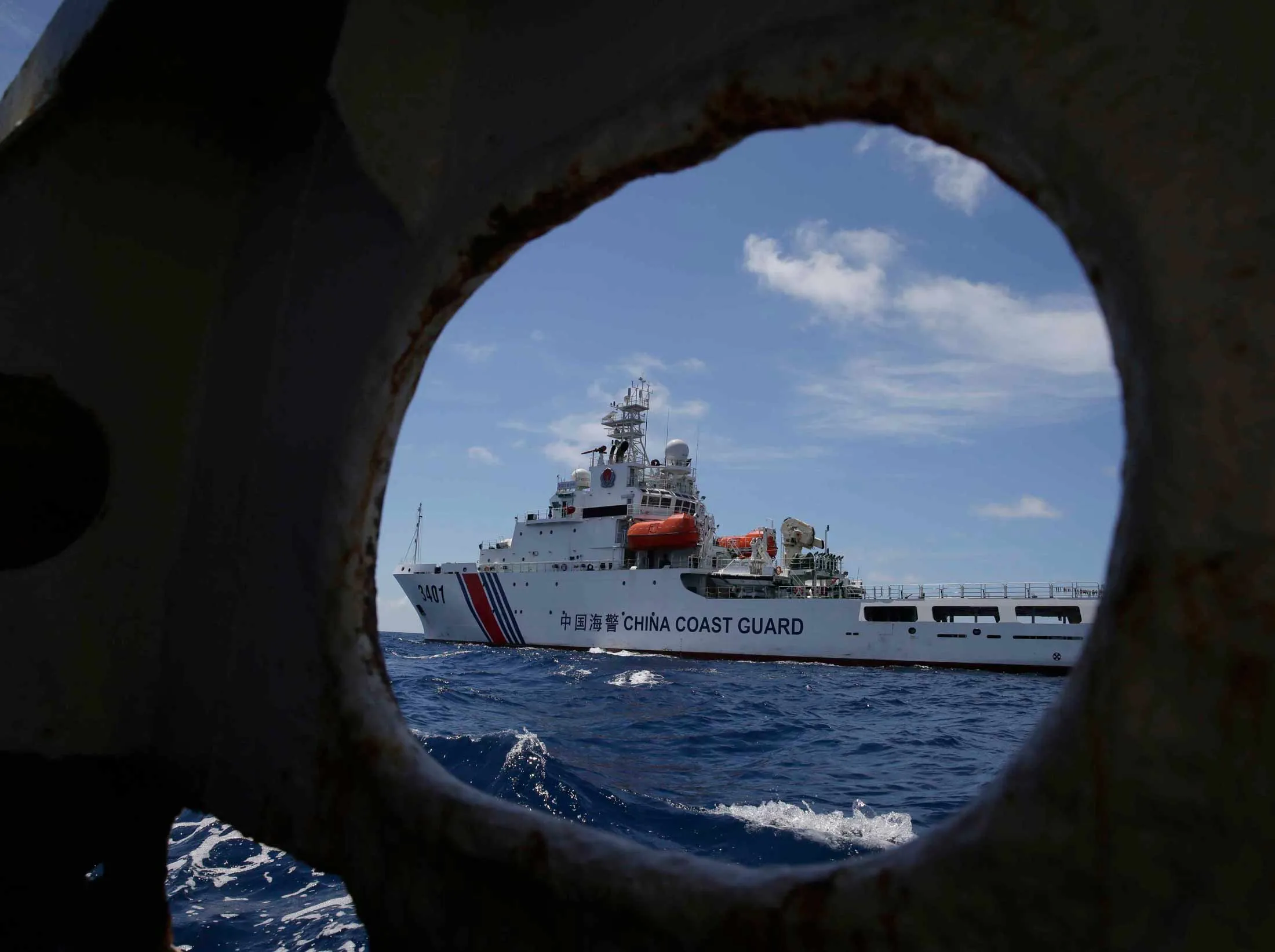 In this March 29, 2014 file photo, a China Coast Guard vessel attempts to block a Philippine government vessel.
