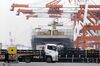 A container is loaded onto the MSC Rafaela container ship, operated by Mediterranean Shipping Company SA (MSC), at a shipping terminal in Yokohama, Kanagawa Prefecture, Japan, on Monday, March 30, 2020. Economists are slashing forecasts for the Japanese economy as exports are hit from overseas lockdowns and rising domestic virus cases force the Tokyo governor to request residents to stay home.