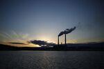 Emissions rise from the Dominion Resources Inc. Mount Storm Generating Station at sunset in Mount Storm, West Virginia, U.S., on Wednesday, Jan. 25, 2017. Dominion Resources Inc. is scheduled to release earnings figures on February 1.