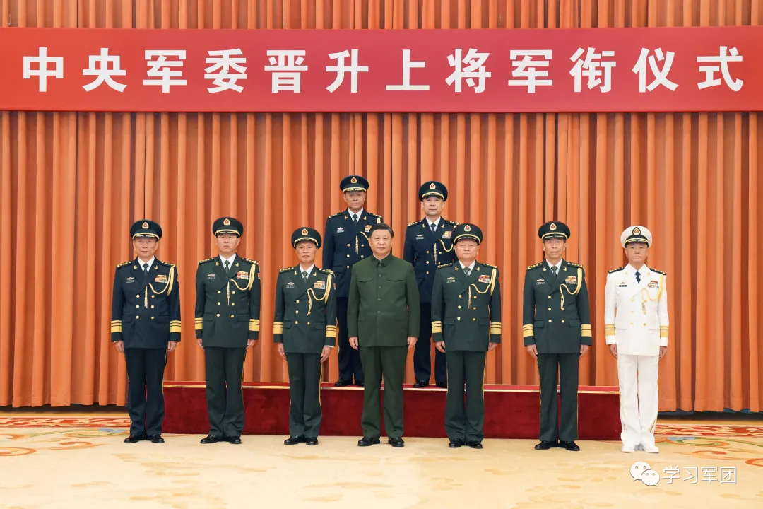 Wang Houbin, top left, and Xu Xisheng, top right, during a ceremony on July 31.