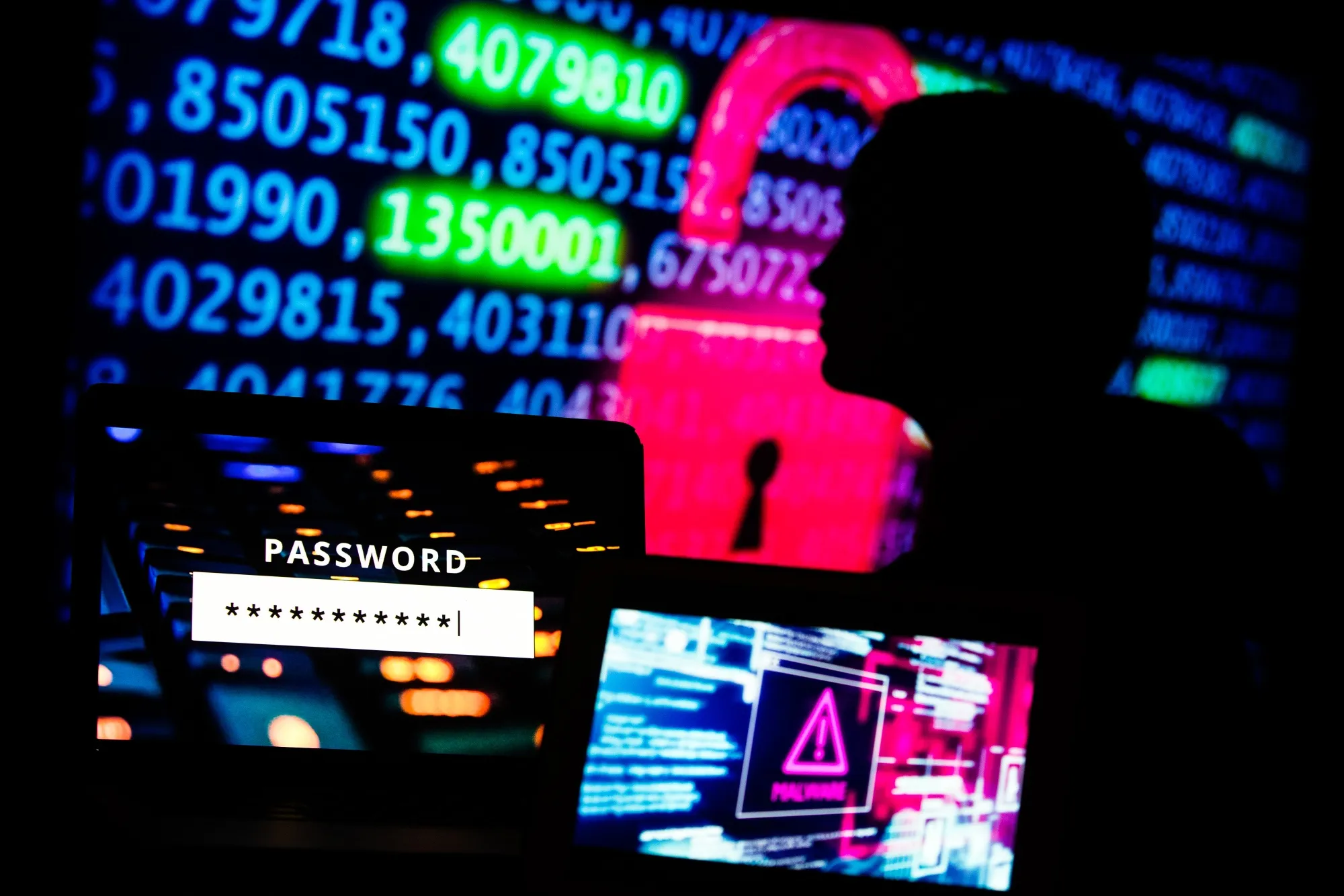 Computer code displayed on screens.