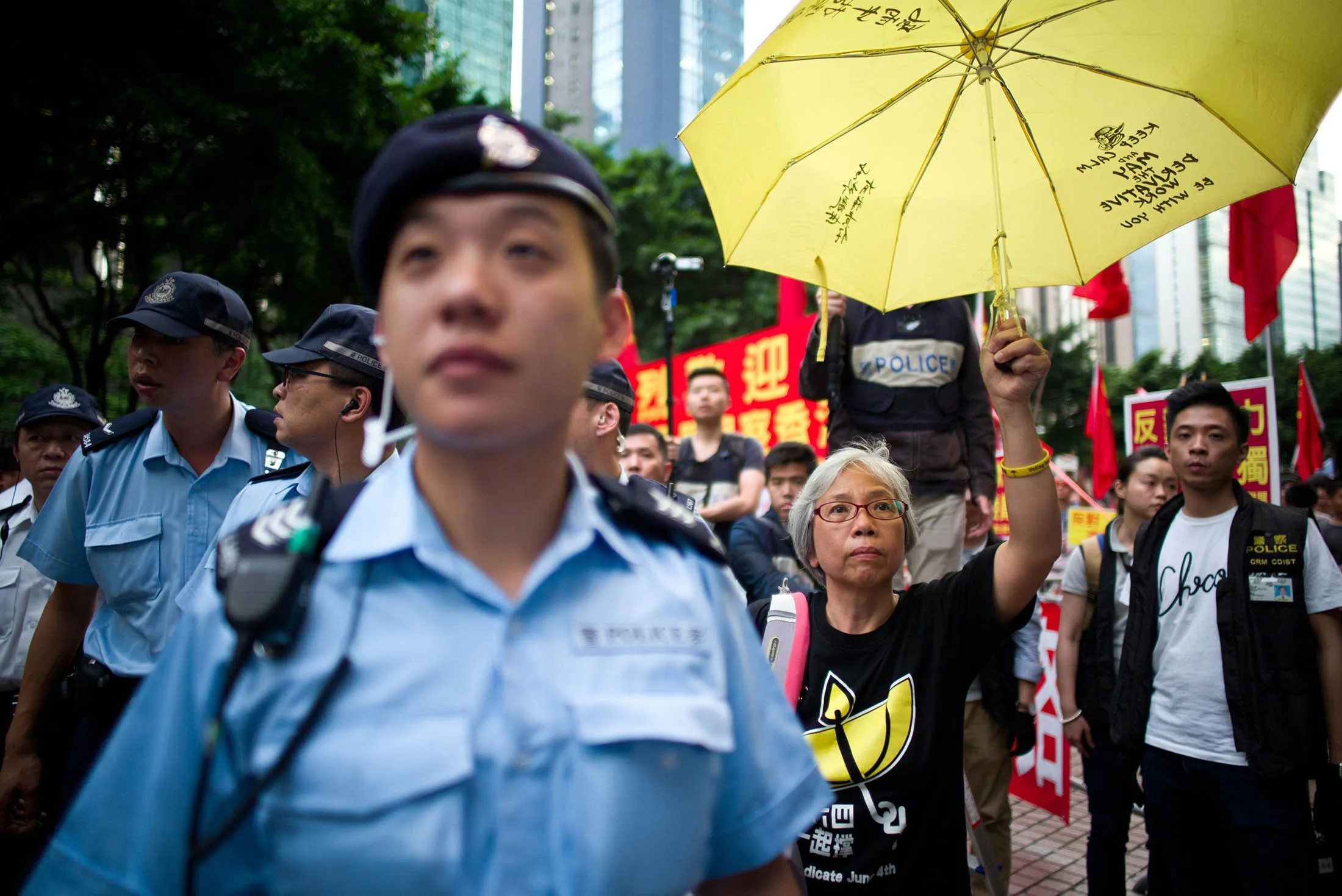 A protester holds up a yellow umbrella, a symbol of Hong Kong's pro-democracy movement, during during a visit by China's National People's Congress Standing Committee Chairman Zhang Dejiang in Hong Kong in May 2016.
