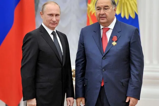 Russian President Vladimir Putin with Alisher Usmanov on Oct. 29, 2013, in Moscow