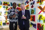 Manhattan district attorney, Cyrus Vance Jr. (right), was asked by a graduate of the Young New Yorkers' program to make a peace sign for a photograph during the Young New Yorkers Project Reset exhibition, held at the Swiss Institute in Manhattan on September 10, 2019.